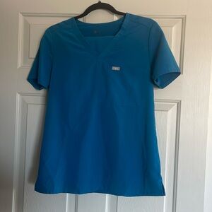 Top & bottom are size small. Couple pen mark areas & pocket zipper needs to be